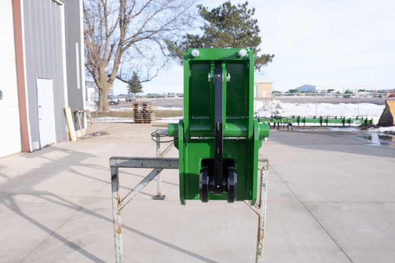 Hydraulic cylinders are protected within the frame to reduce exposure to damage and keep operation clean.